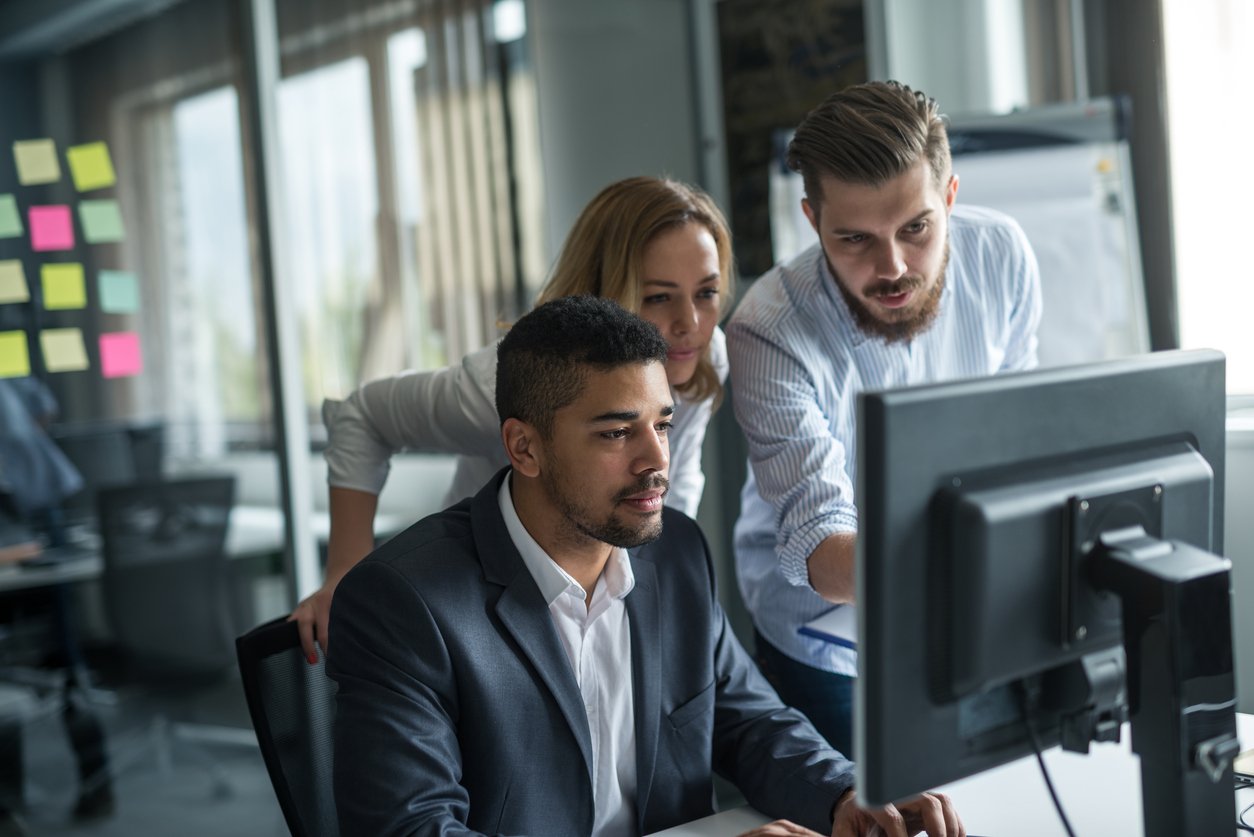 business people working together on computer